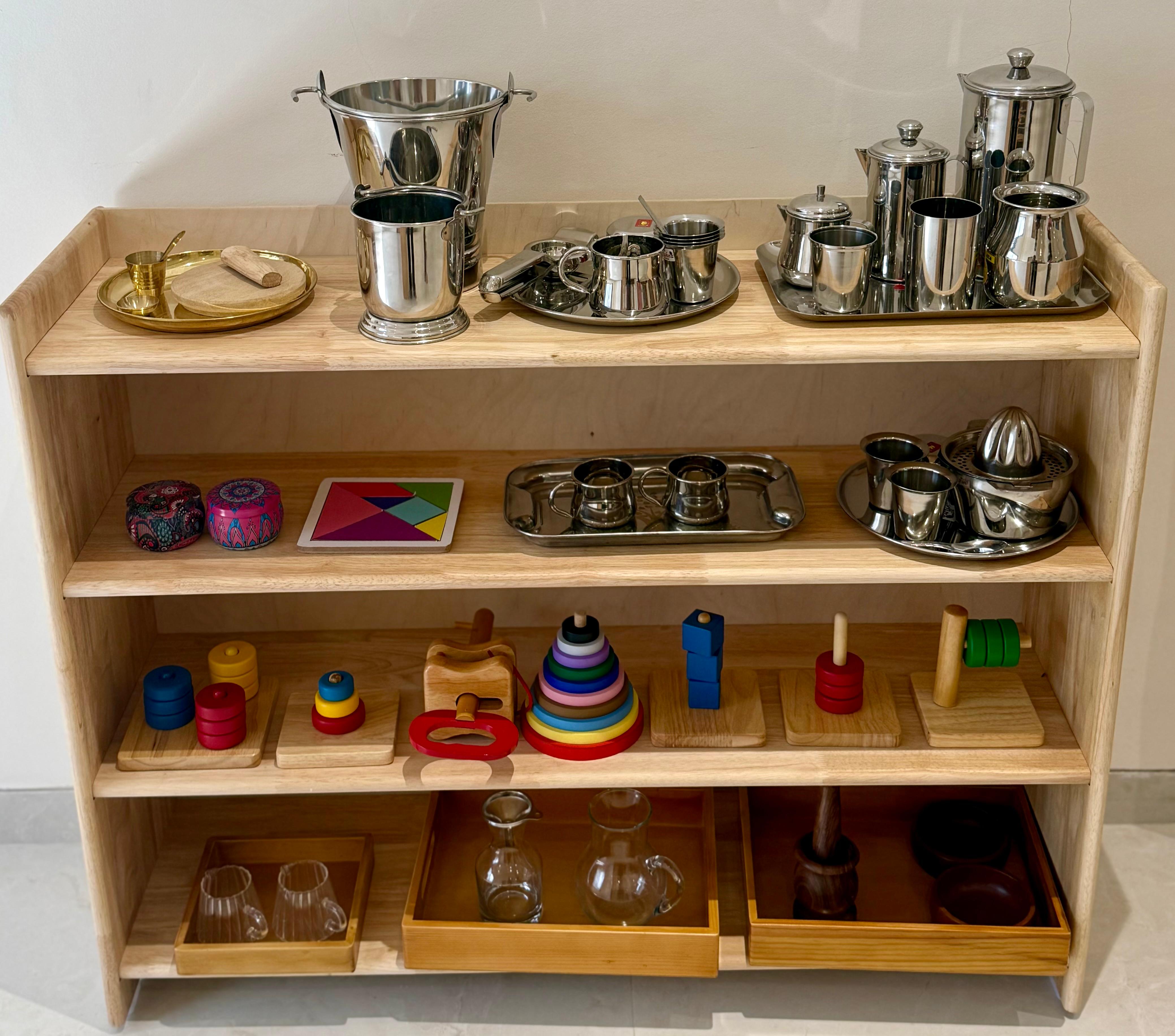 Child exploring sensorial materials at TinyTrails Montessori